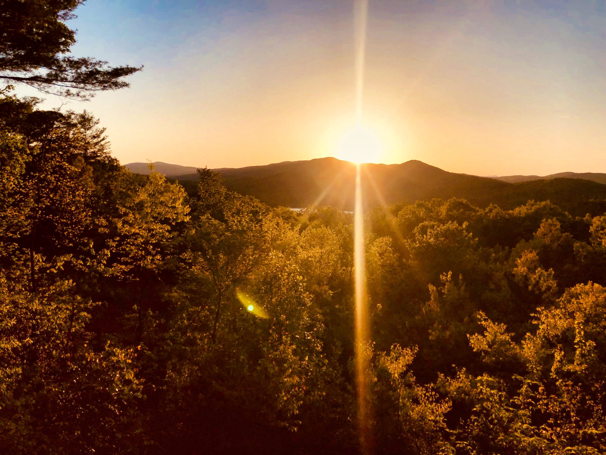 Sunburst through the mountains