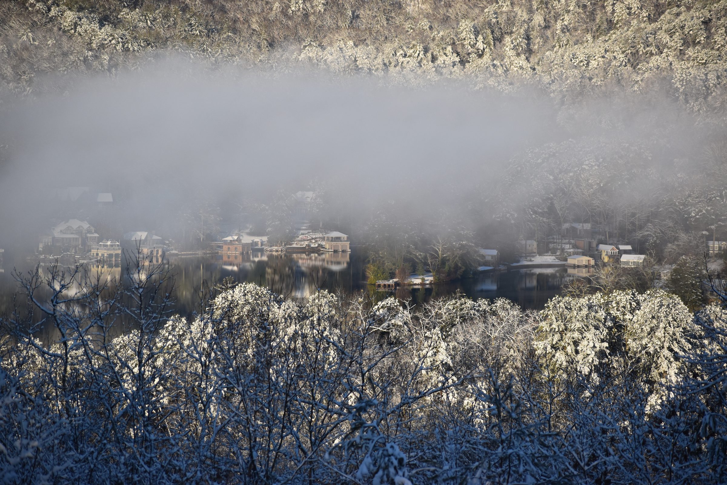 Snow and fog settle over the lake