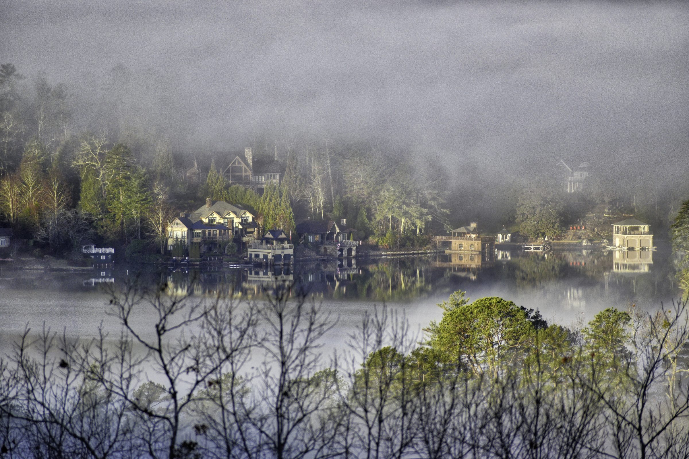 Lake houses in the fog