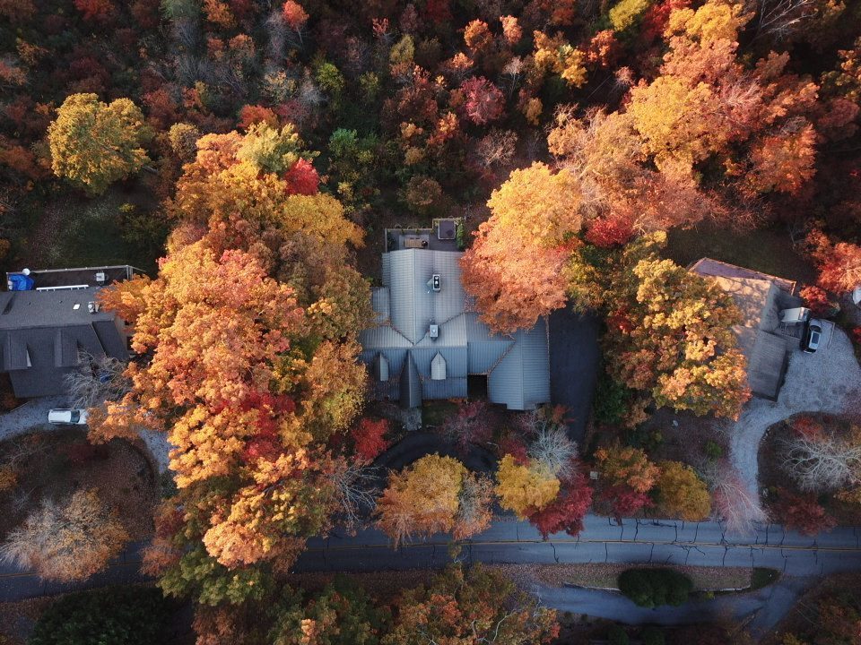 Aerial fall foliage with chapel below