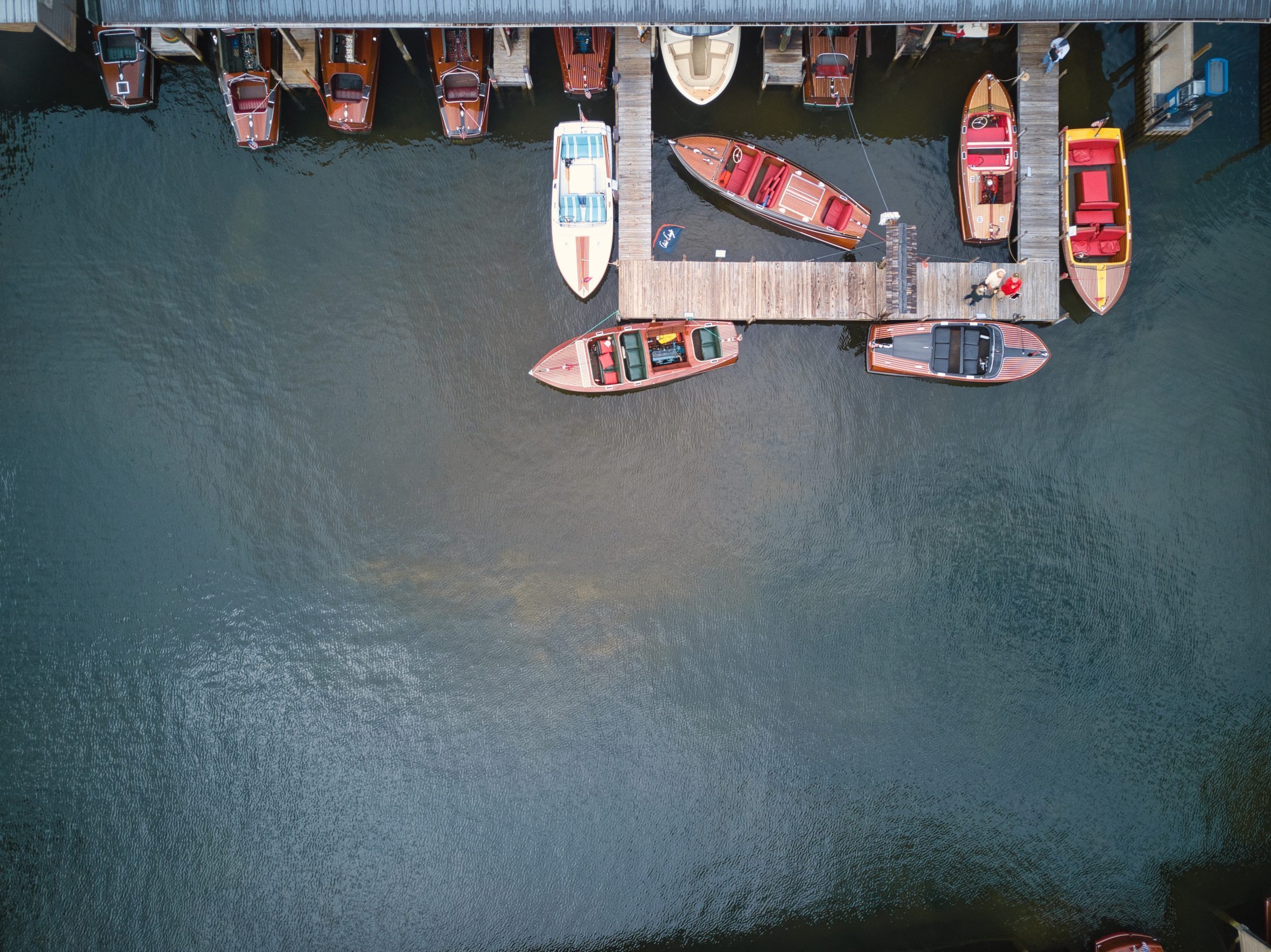 Classic wooden boats at the dock, aerial