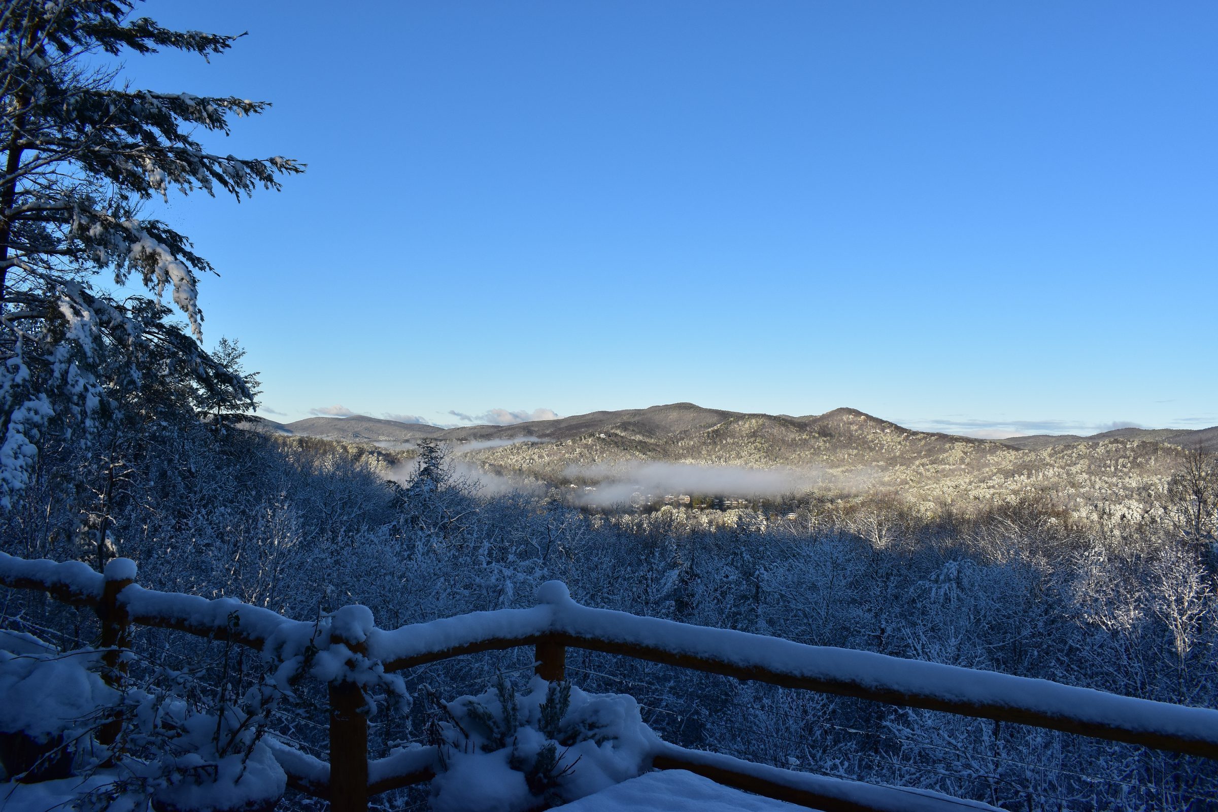 Clearing among snow-covered mountains
