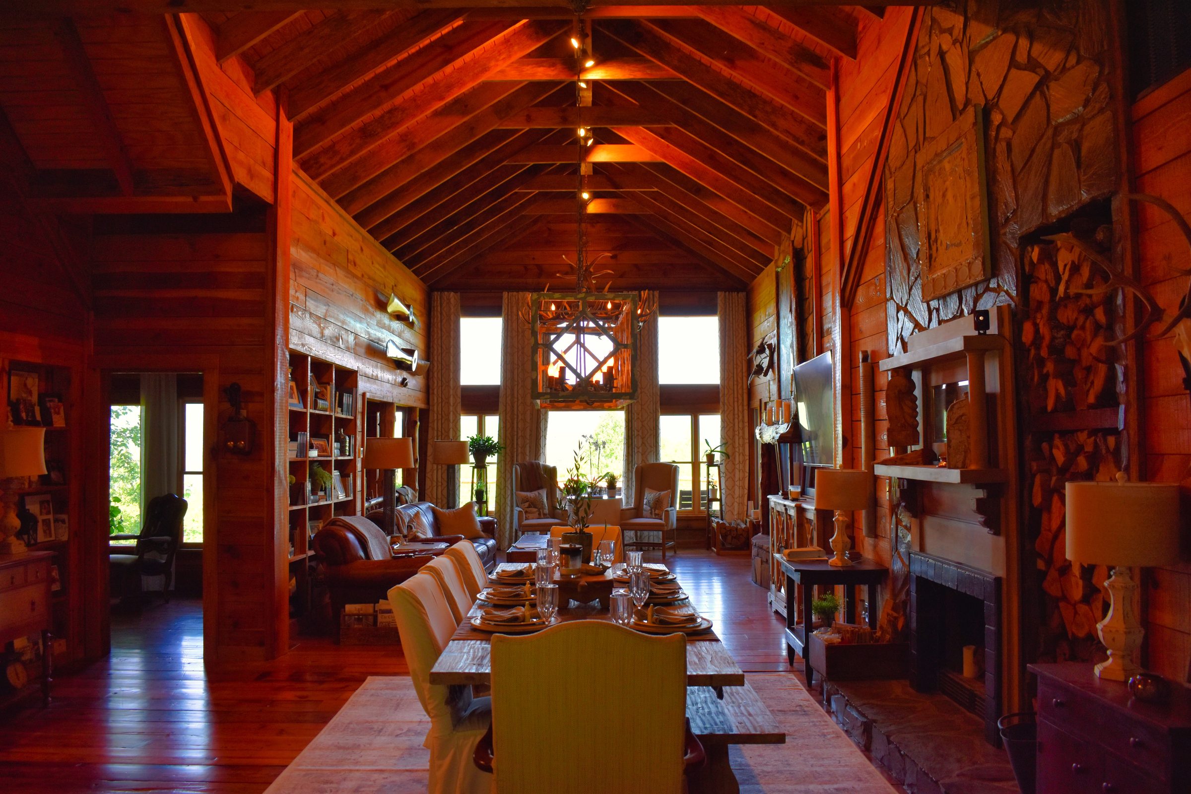 Mountainhouse great room — cathedral ceiling, fireplace, dining table