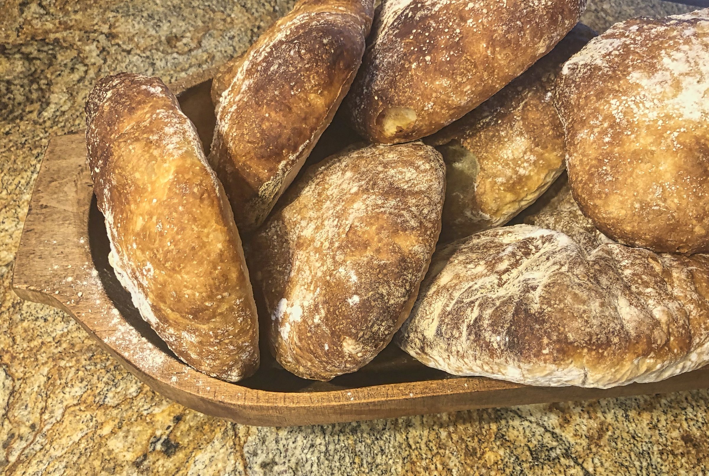 Artisan bread loaves on a wooden board